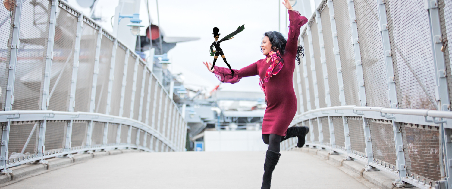 woman dancing with outstretched arm and a 3D avatar in her hand
